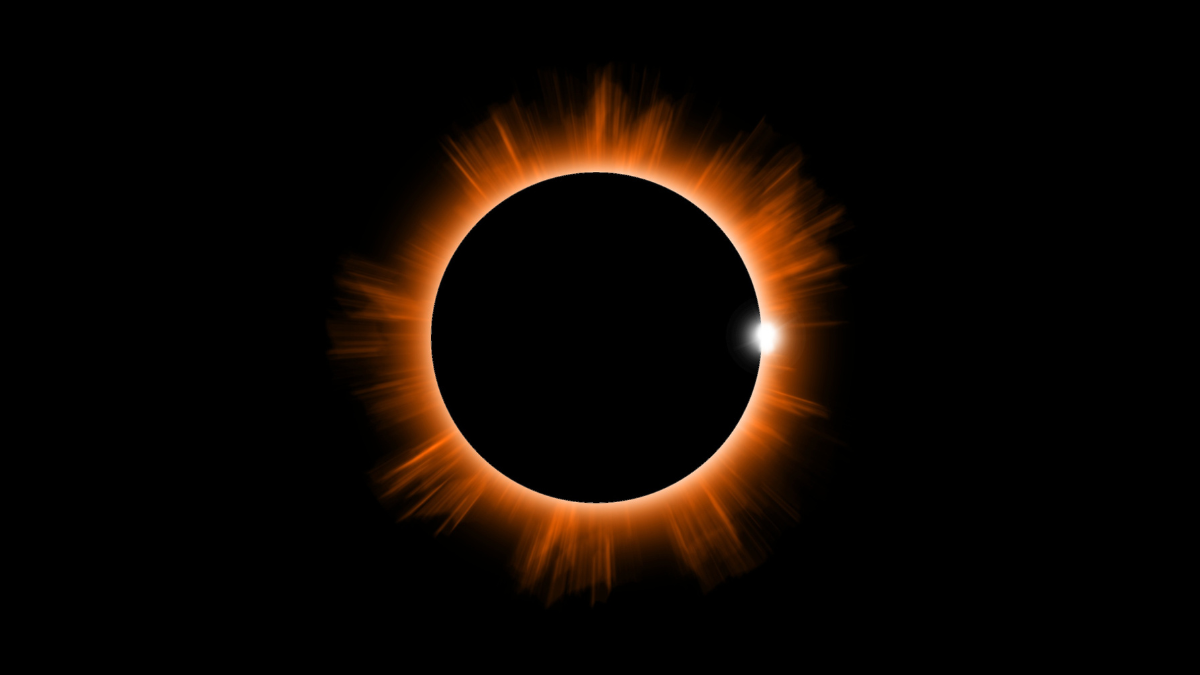 Final phase just before maximum totality of a solar eclipse showing the sun nearly entirely covered by the moon and the diamond ring effect of the last light of the sun slipping behind the moon. An orange glow surrounds the dark moon on a black background